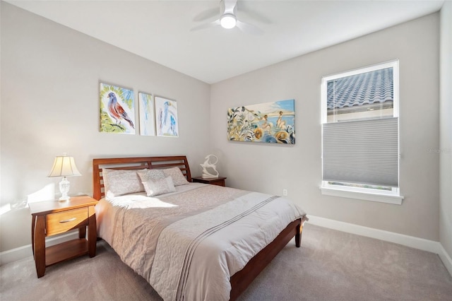 bedroom with carpet flooring, a ceiling fan, and baseboards