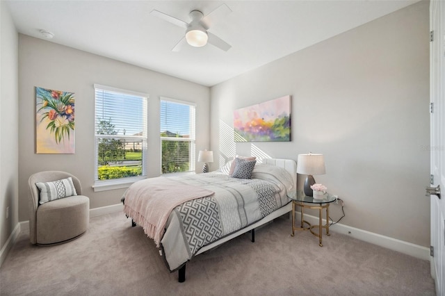 bedroom featuring ceiling fan, baseboards, and carpet