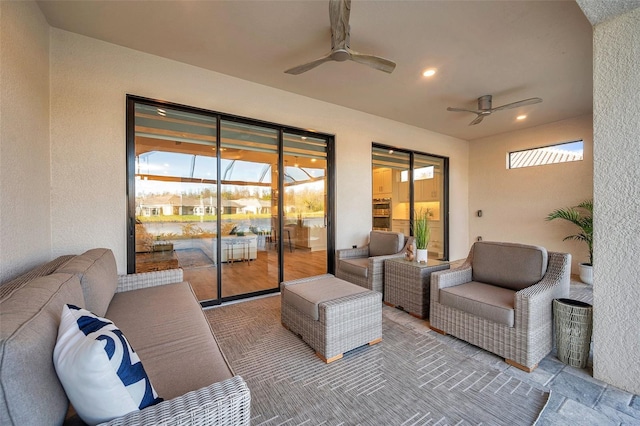 exterior space with an outdoor living space and ceiling fan