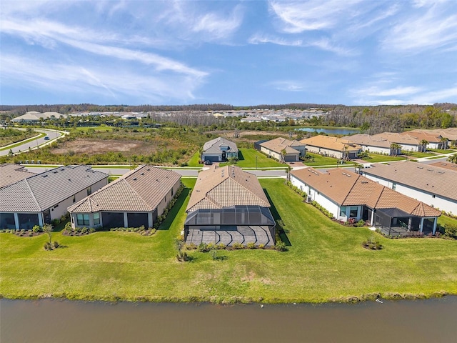 bird's eye view with a residential view and a water view