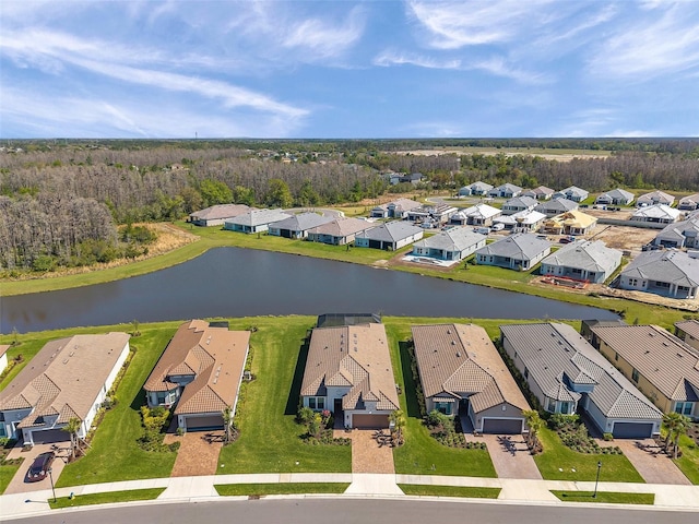 bird's eye view with a residential view and a water view