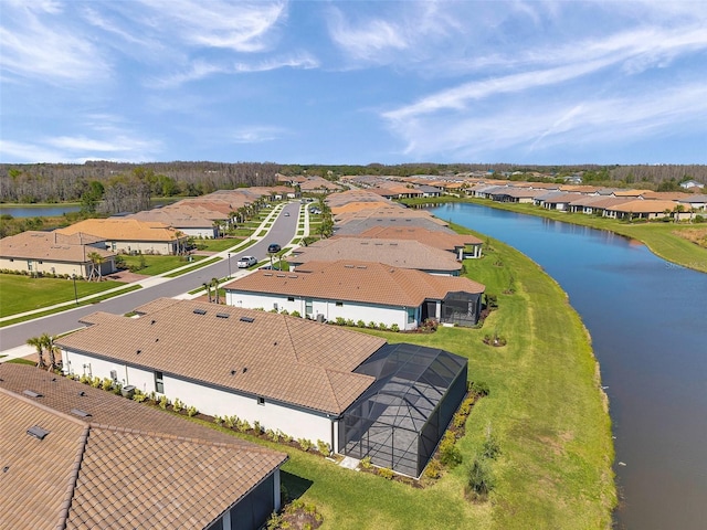 bird's eye view featuring a residential view and a water view