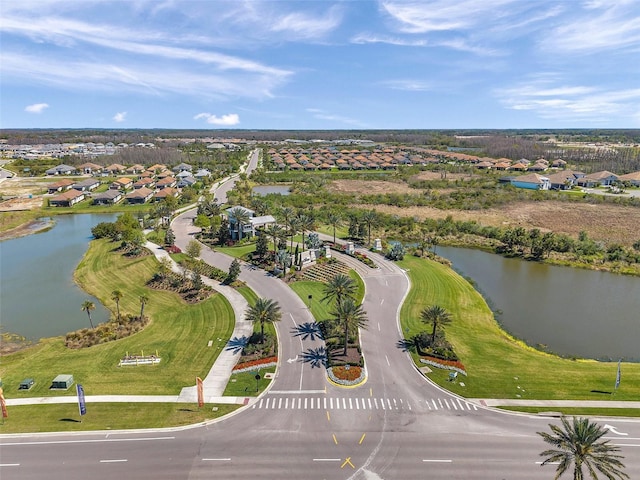 aerial view featuring a residential view and a water view