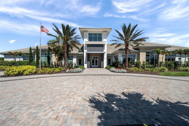 view of building exterior featuring decorative driveway