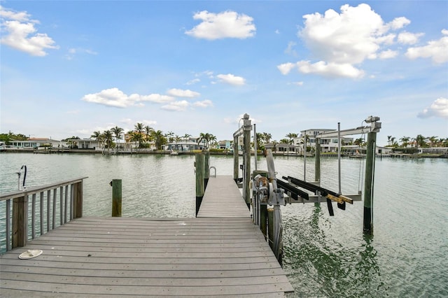 dock area featuring a water view and boat lift