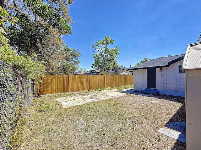 view of yard with entry steps, fence private yard, and a patio area