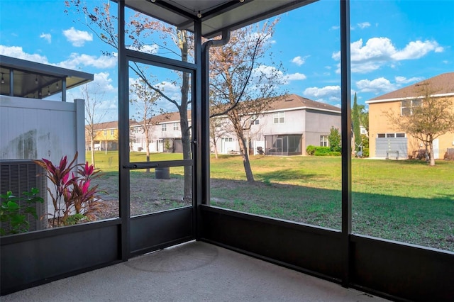 unfurnished sunroom featuring a residential view