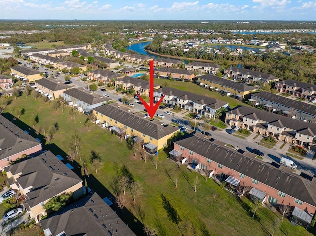 birds eye view of property featuring a residential view and a water view