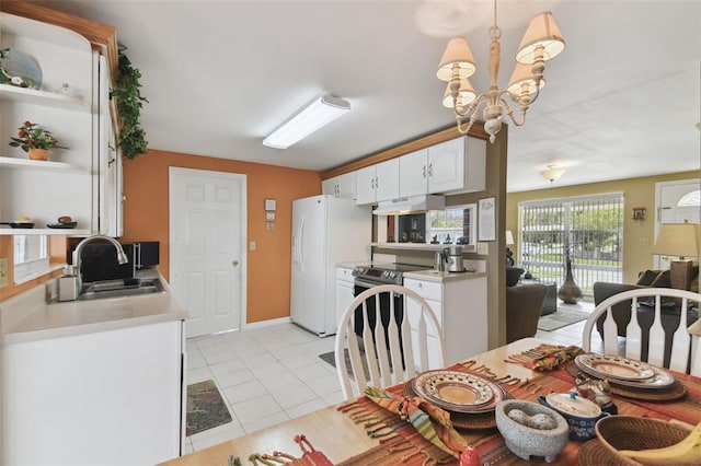 dining area with an inviting chandelier and light tile patterned flooring