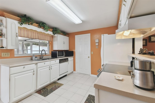 kitchen with white cabinetry, white appliances, light countertops, and a sink