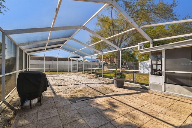 unfurnished sunroom with lofted ceiling