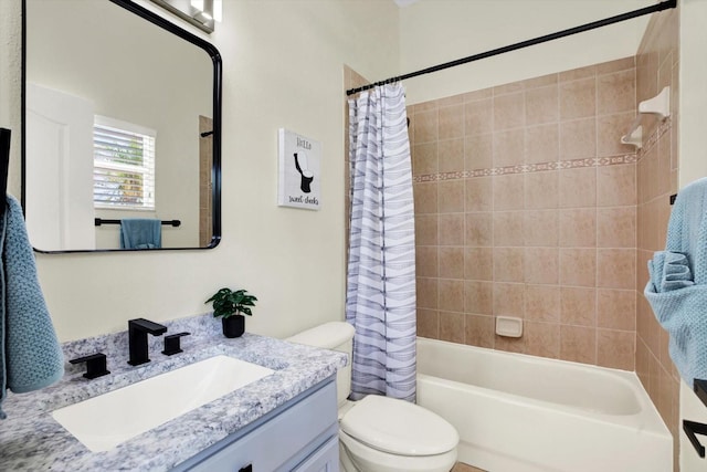 bathroom with toilet, shower / bath combo, and vanity