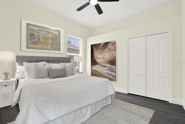 bedroom with baseboards, ceiling fan, wood finished floors, and a closet