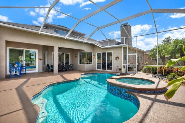 view of swimming pool with glass enclosure, a patio, and a pool with connected hot tub