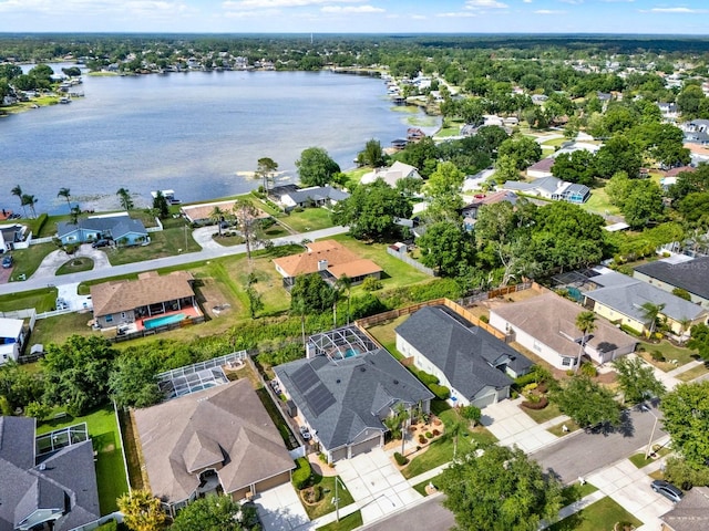 bird's eye view with a residential view and a water view