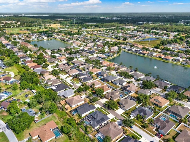 bird's eye view featuring a water view and a residential view