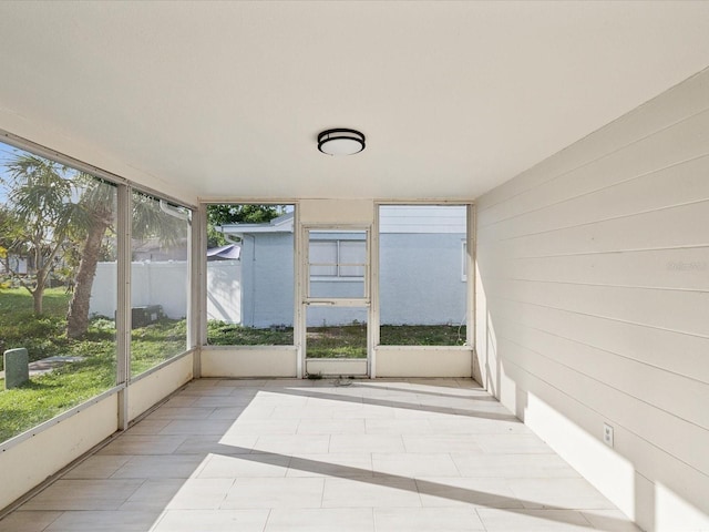 unfurnished sunroom featuring plenty of natural light