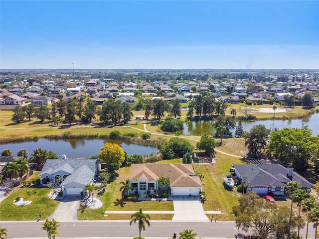 bird's eye view with a residential view and a water view