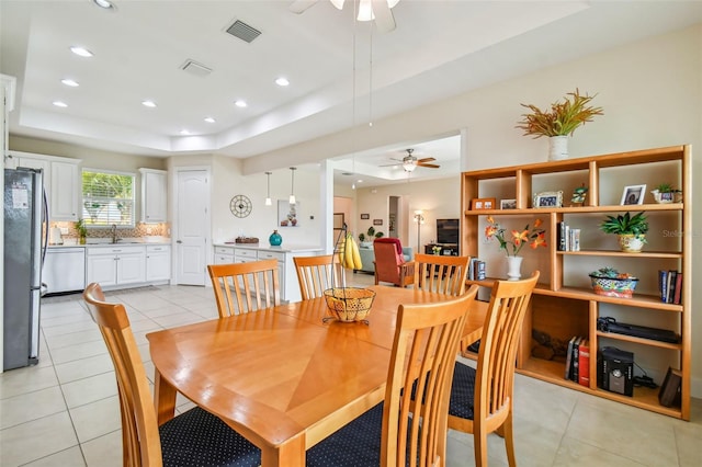 dining area featuring visible vents, recessed lighting, light tile patterned floors, a raised ceiling, and ceiling fan