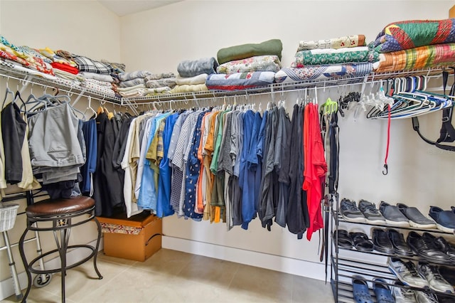 spacious closet featuring tile patterned floors