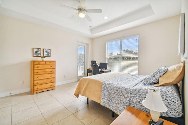 tiled bedroom with access to exterior, ceiling fan, baseboards, recessed lighting, and a raised ceiling