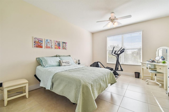 bedroom featuring tile patterned floors, a ceiling fan, and baseboards