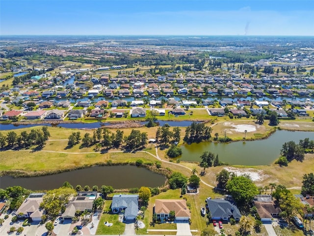 bird's eye view with a residential view and a water view