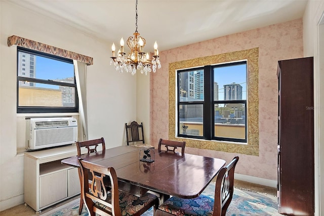 dining area featuring a notable chandelier, cooling unit, wallpapered walls, and baseboards