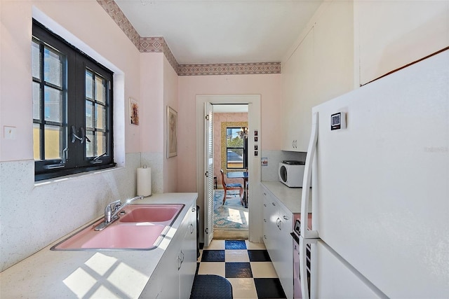 bathroom with tile patterned floors and vanity