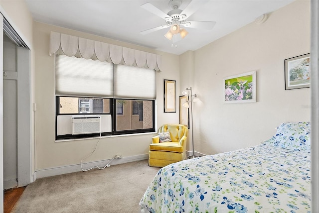 bedroom with cooling unit, baseboards, carpet, and a ceiling fan