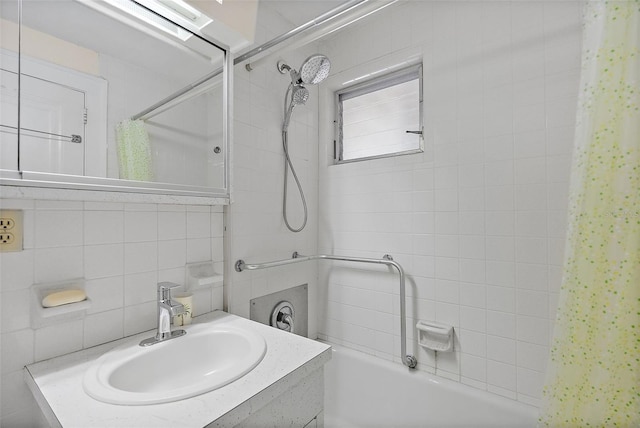 full bath featuring vanity, tile walls, shower / bathtub combination with curtain, and tasteful backsplash