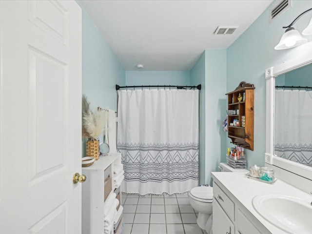 full bath with visible vents, toilet, vanity, and tile patterned flooring