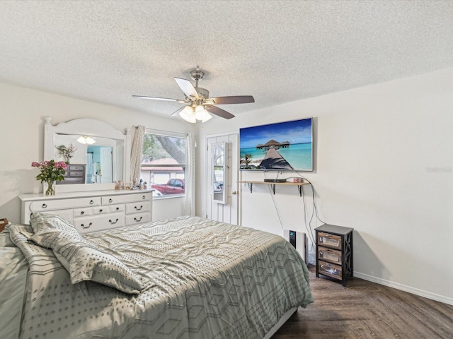 bedroom featuring baseboards, a textured ceiling, and a ceiling fan