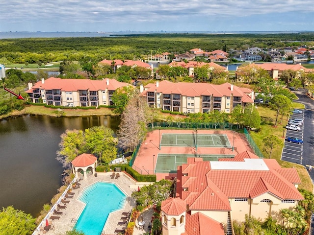 bird's eye view featuring a residential view and a water view