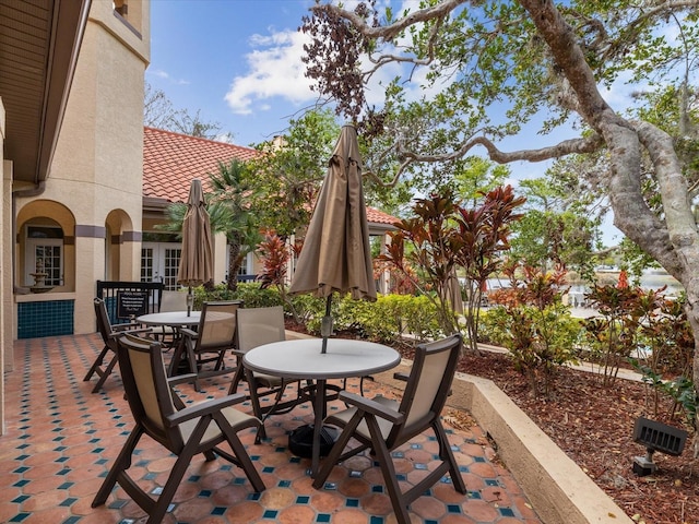 view of patio / terrace with outdoor dining area and french doors