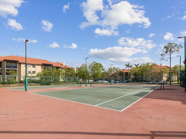 view of sport court with fence