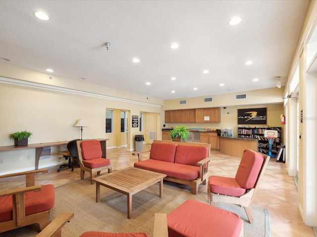 living area featuring light tile patterned floors, visible vents, and recessed lighting