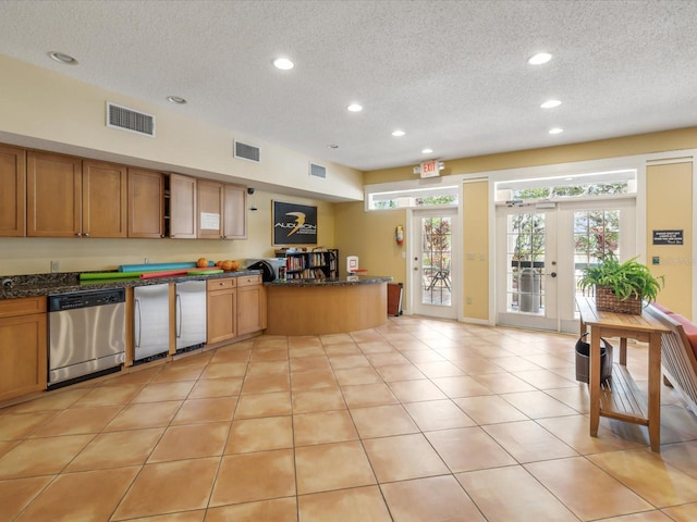 kitchen with open shelves, visible vents, dishwasher, and a peninsula