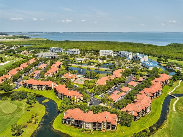 birds eye view of property featuring a water view and view of golf course