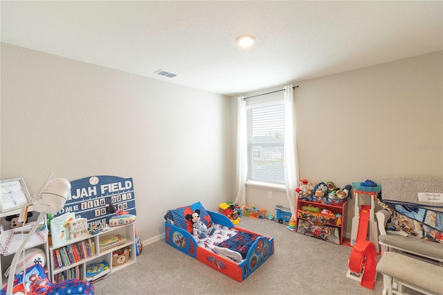 recreation room with visible vents and carpet floors