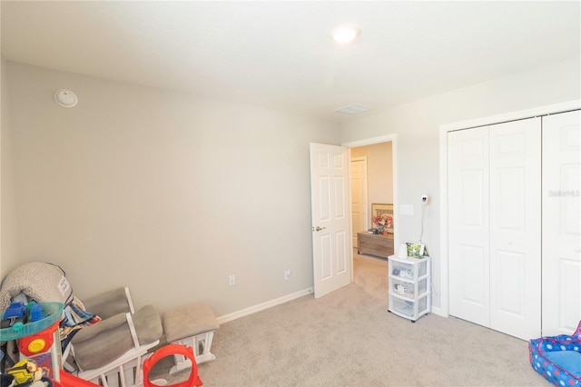 game room with light carpet and baseboards