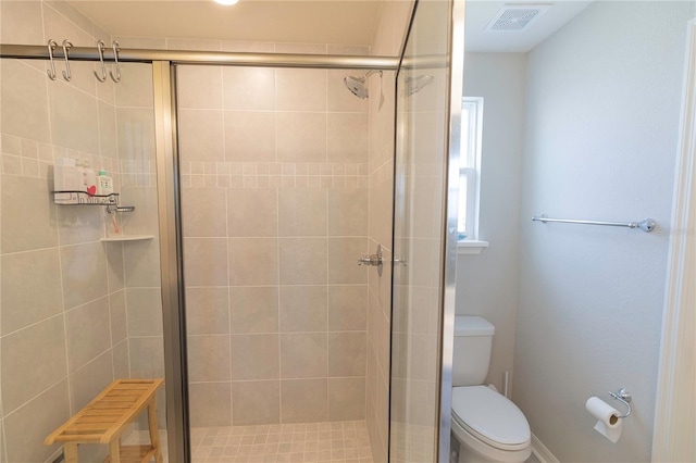 full bath featuring a shower stall, toilet, and visible vents