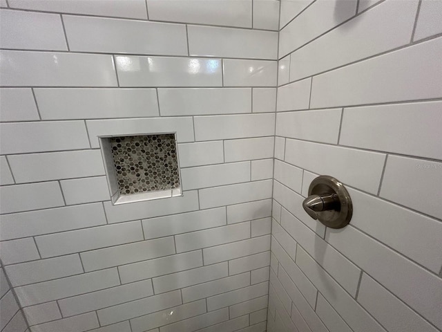 bathroom with tiled shower