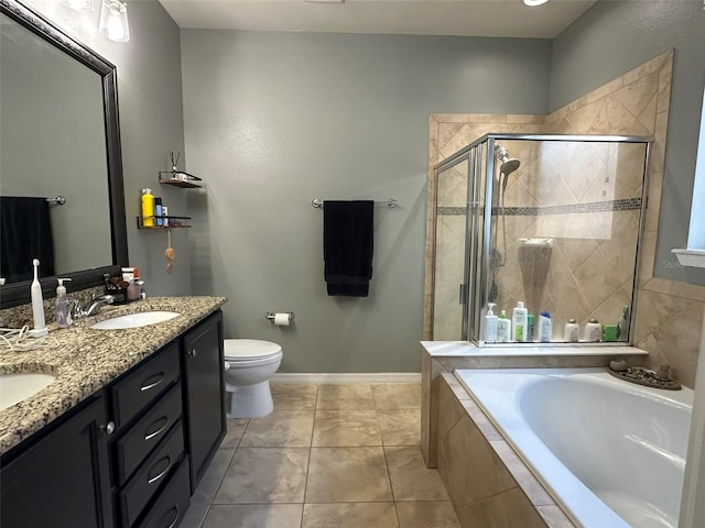 full bath featuring a shower stall, toilet, a garden tub, double vanity, and a sink