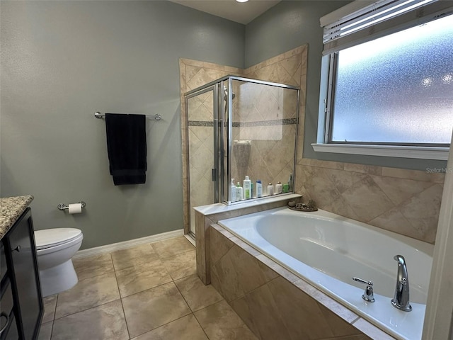 bathroom featuring a stall shower, tile patterned flooring, baseboards, a bath, and vanity