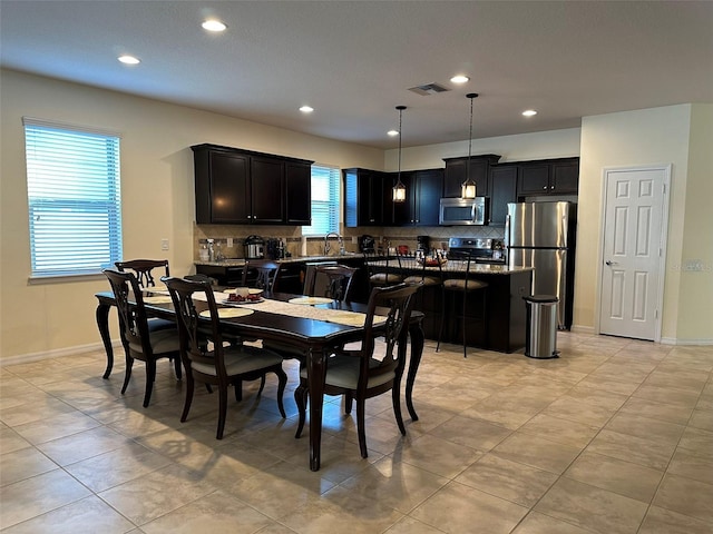 dining room featuring recessed lighting, baseboards, and visible vents