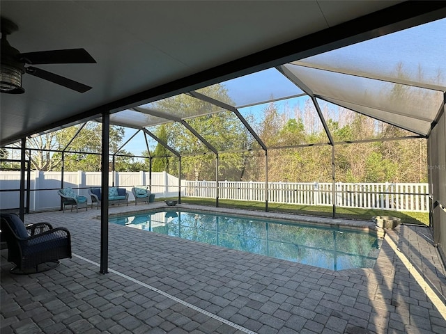 view of swimming pool with a patio area, a fenced in pool, glass enclosure, and a fenced backyard