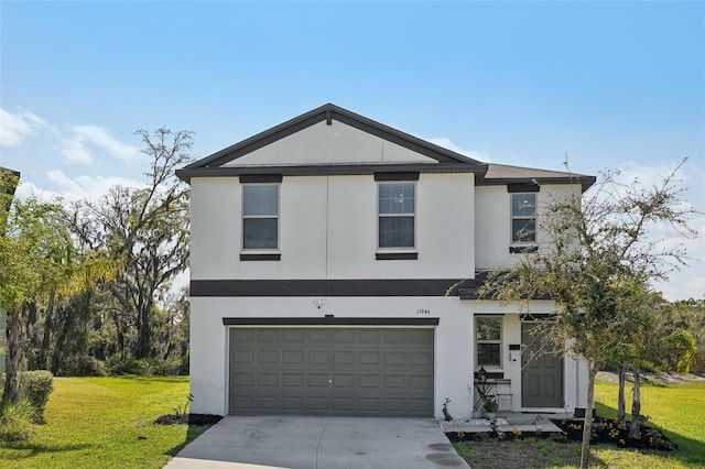 view of front of house with stucco siding, driveway, an attached garage, and a front yard