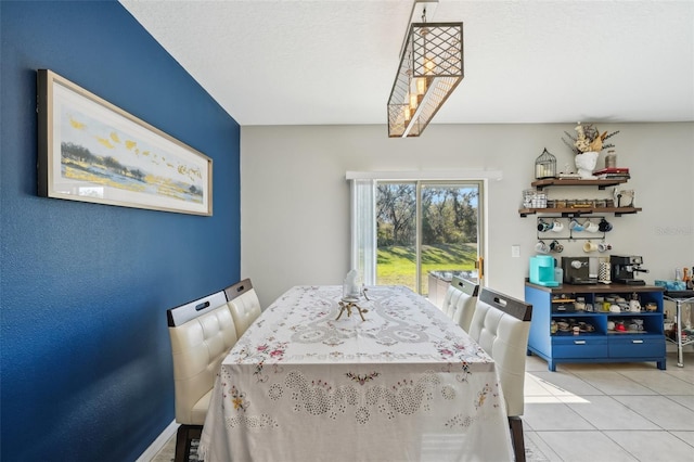 dining space with light tile patterned flooring