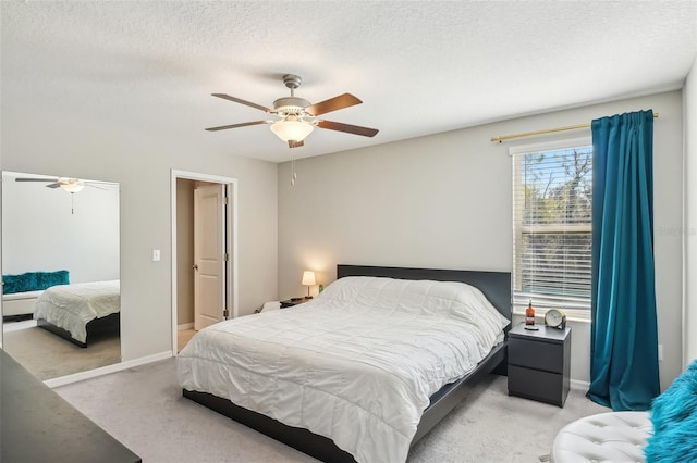 bedroom with a textured ceiling and carpet